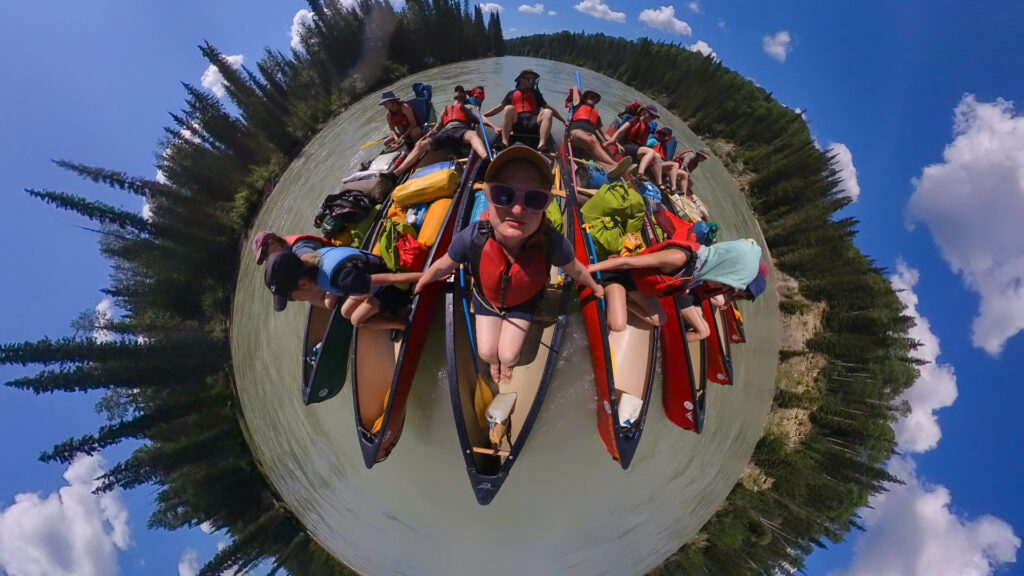group of canoes on a multi-day canoe trip in Canada